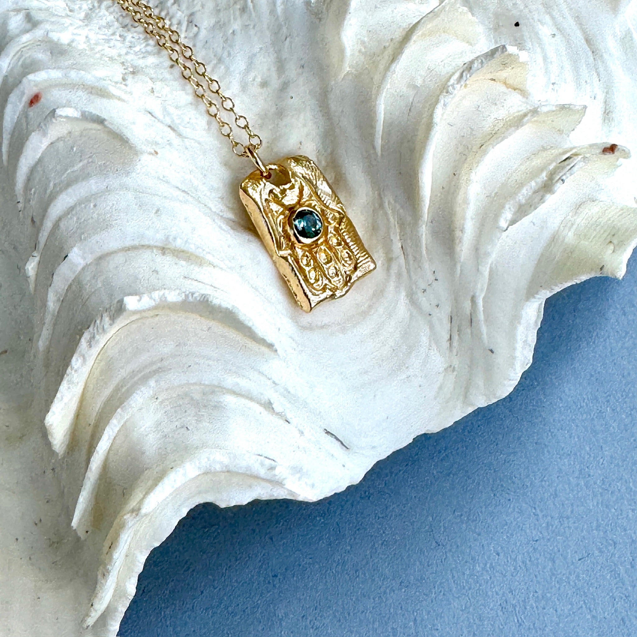 Gold Hamsa with Blue Montana Sapphire