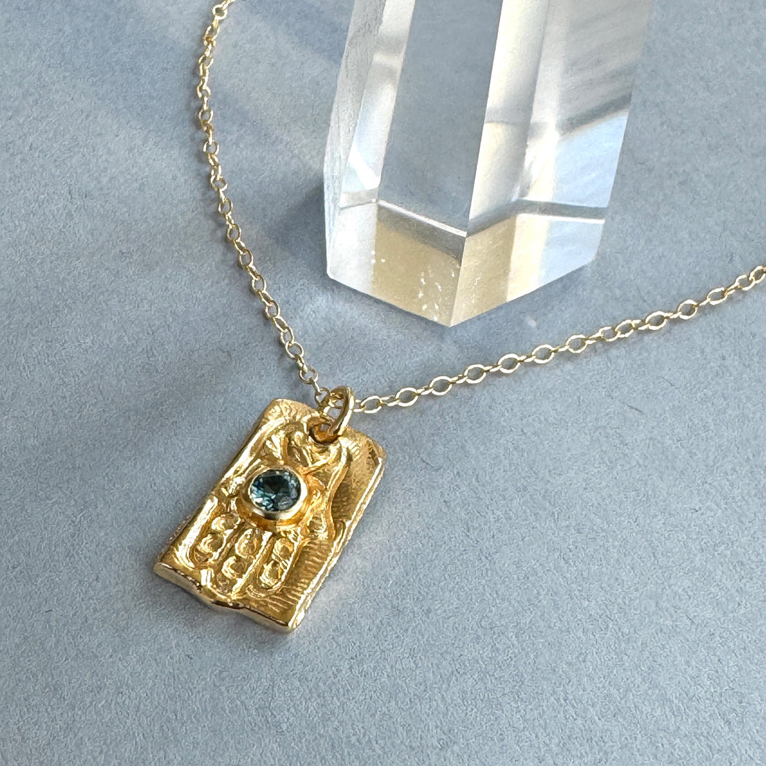 Gold Hamsa with Blue Montana Sapphire